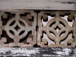 Two panels with internal circular patterns, temple